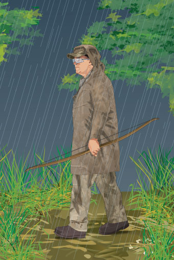 Bowhunter wearing rainwear